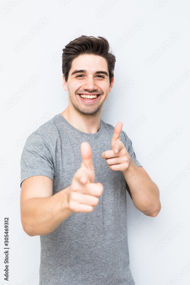 Handsome funny man pointing at you isolated on white background Handsome funny man pointing at you isolated on white background