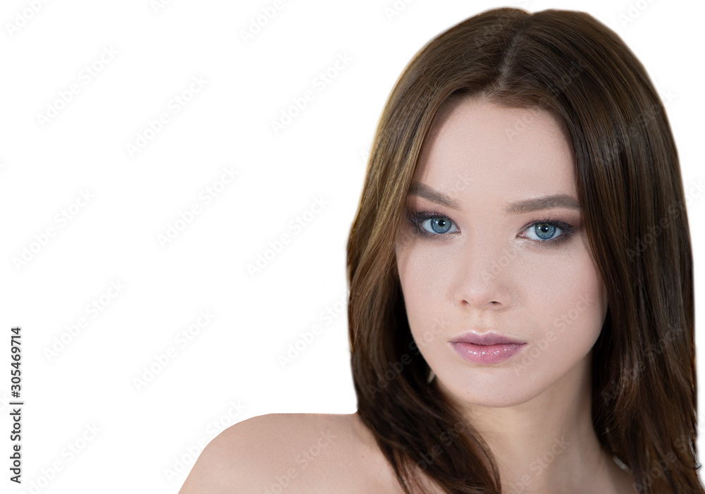 The face of a beautiful girl. Eighteen year old woman. Model with clean skin.Blue-eyed brunette The face of a beautiful girl. Eighteen year old woman. Model with clean skin.Blue-eyed brunette