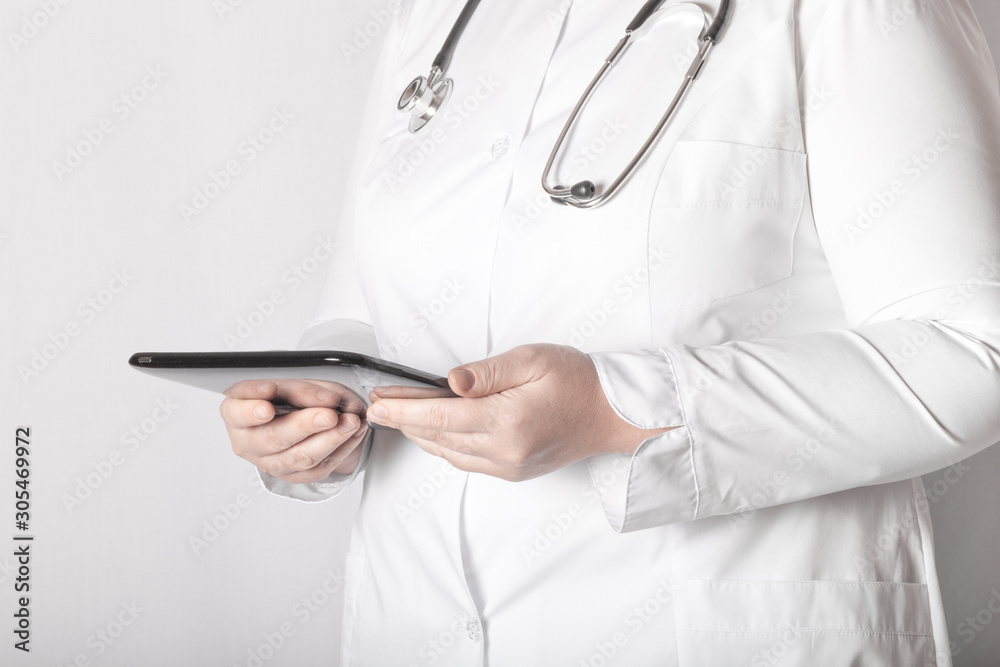 Woman doctor in uniform with a phonendoscope Woman doctor in uniform with a phonendoscope