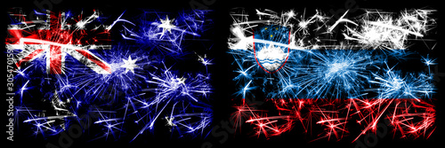 Australia, Ozzie vs Slovenia, Slovenian New Year celebration sparkling fireworks flags concept background. Combination of two abstract states flags. © Vlad