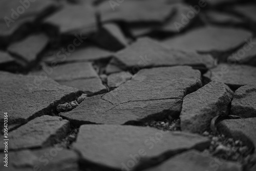 Surface made of natural wild stones, bw photo.