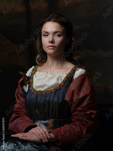 Portrait of a young woman in the style of a Renaissance painting. photo