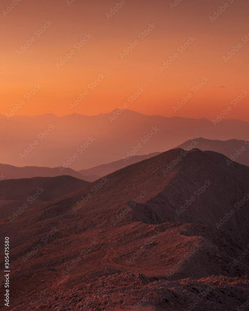 Beautiful sunset over Taurus Mountains from the top of Tahtali Mountain near Kemer, Antalya, Turkey