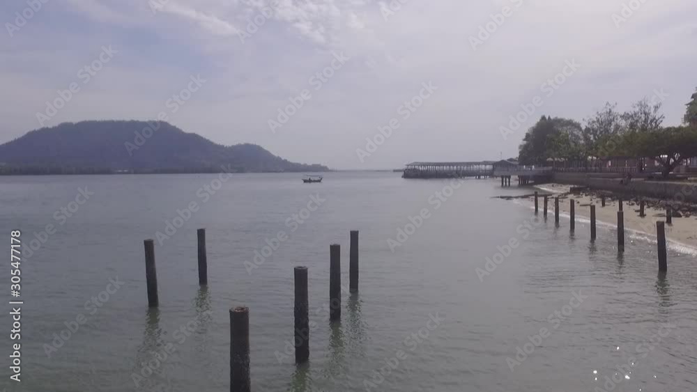 Aerial view of a coastline, beach, sea and small town in northern Malaysia in a state known as Lumut Perak. Aerial view of a coastline, beach, sea and small town in northern Malaysia in a state known as Lumut Perak.