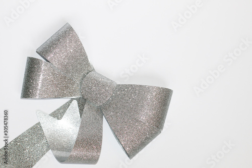 grey bow isolated on white background with copy space. Christmas bow. New Year 2020. Presents
