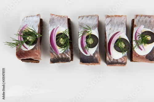 Sliced salted herring on a ...