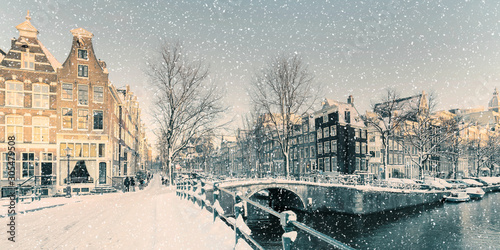 Winter snow view of a Dutch canal in Amsterdam