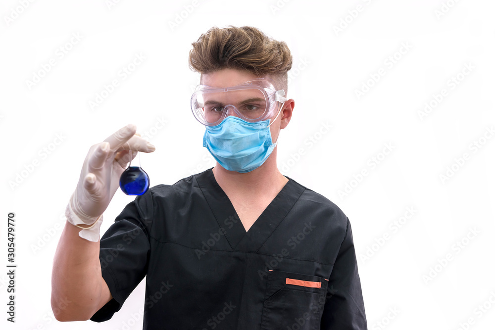 Handsome man chemist with flask making experiment in laboratory Handsome man chemist with flask making experiment in laboratory