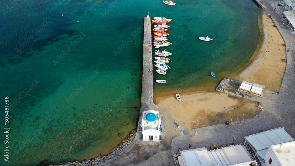 Aerial drone photo of traditional wooden fishing boat in old port of Mykonos island, Cyclades, Greece Aerial drone photo of traditional wooden fishing boat in old port of Mykonos island, Cyclades, Greece
