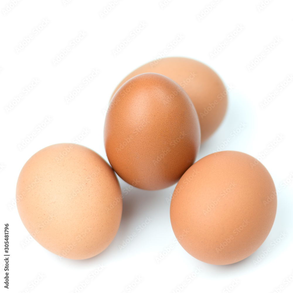 Four brown eggs separated with isolated from the white background. Four brown eggs separated with isolated from the white background.