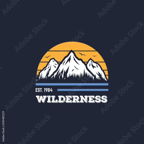 Mountain adventure badge, logo or print for t-shirt design. Travel and camping concept. Text and letters, flying birds, sun and forest on mountain background.