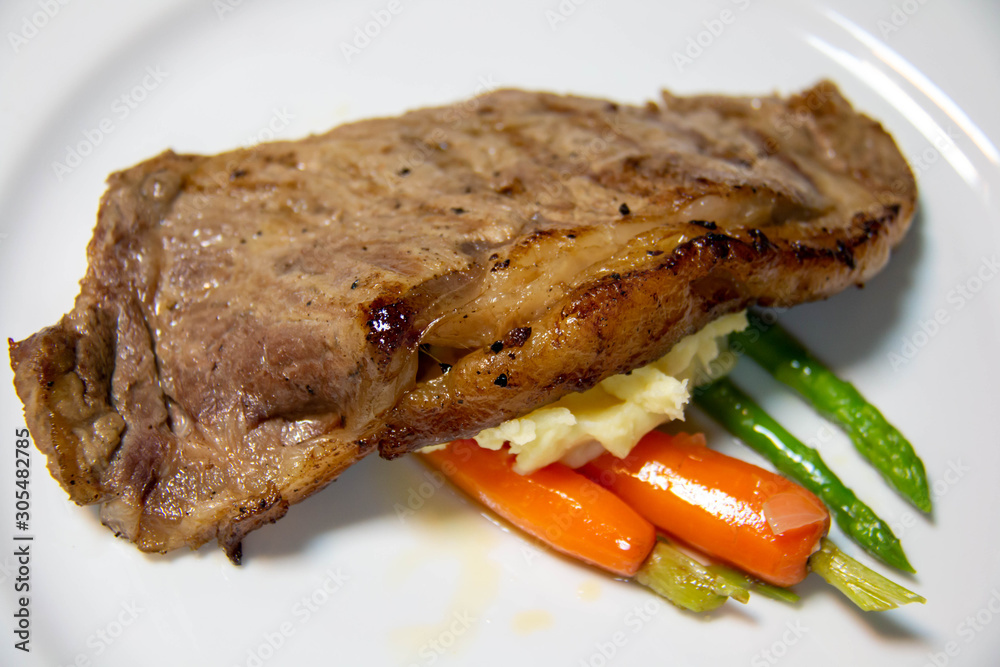  beef steak with brown sauce and vegetables