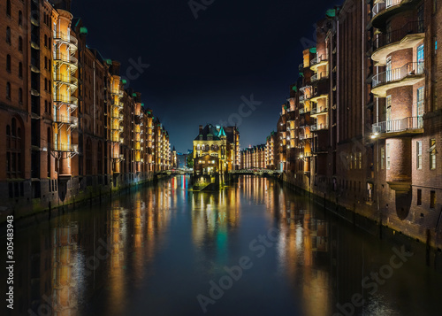long exposure shot of canal in old warehouse district Speicherstadt in Hamburg, Germany at night © Christian Horz