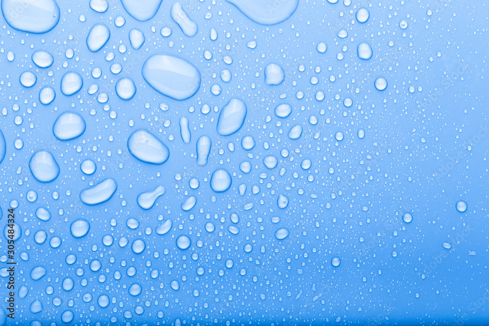Drops of water on a color background. Selective focus. Blue. Toned Drops of water on a color background. Selective focus. Blue. Toned