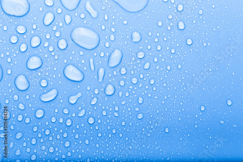 Drops of water on a color background. Selective focus. Blue. Toned