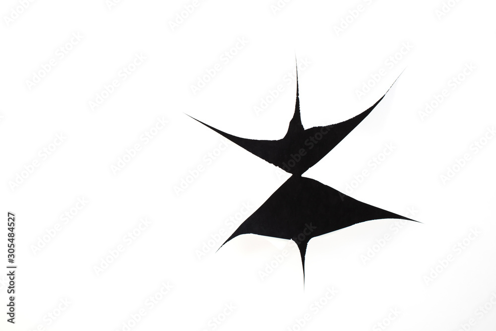 Black holes on white paper. Torn paper sheet Black holes on white paper. Torn paper sheet