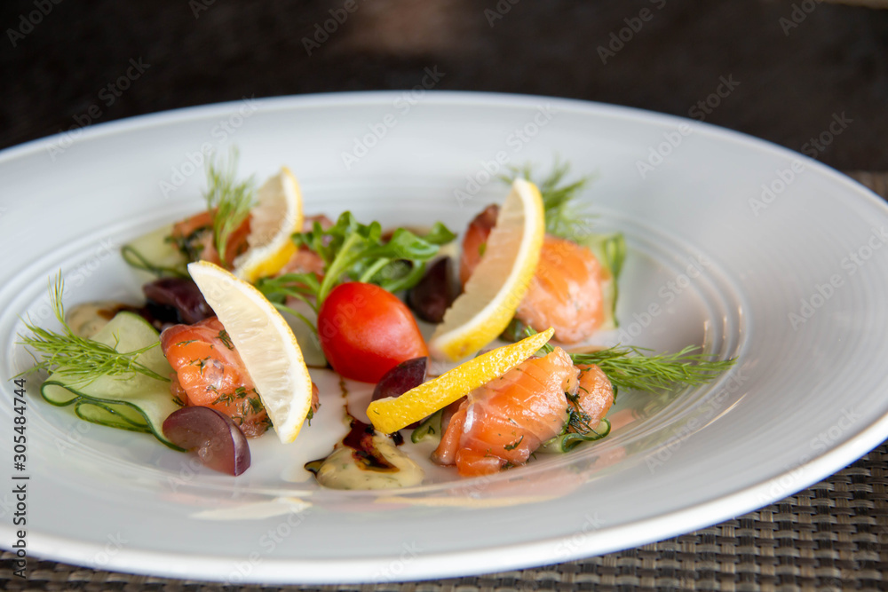 mixed Salmond salad on white plate mixed Salmond salad on white plate