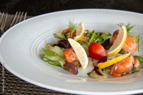  mixed Salmond salad on white plate