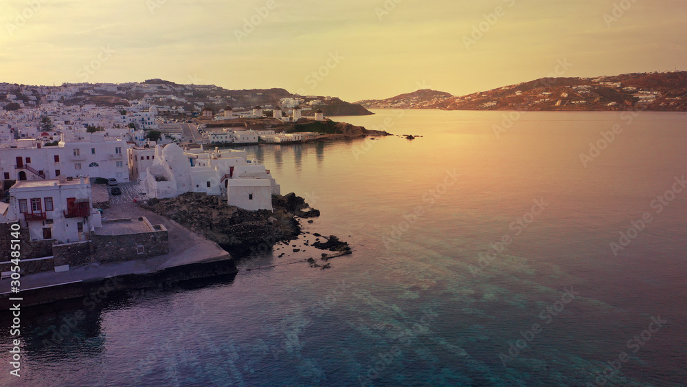 Aerial drone photo of beautiful sunset as seen from main village of Mykonos island, Cyclades, Greece