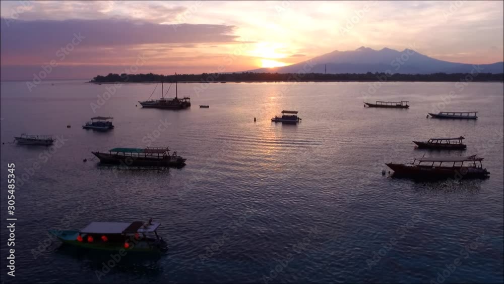 Aerial view of a coastline at Gili Terawangan with Mount Rinjani at the background. Aerial view of a coastline at Gili Terawangan with Mount Rinjani at the background.