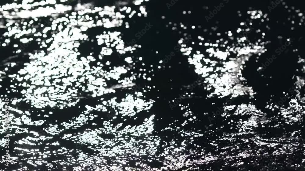 Swimmer hand performing a blow to the water in the pool. Close up. Night shot. Swimmer hand performing a blow to the water in the pool. Close up. Night shot.