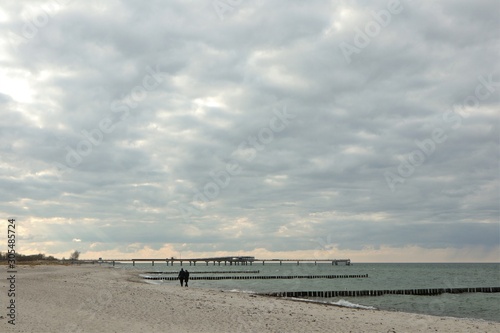 Fototapeta Naklejka Na Ścianę i Meble -  beach stroll on a cloudy day