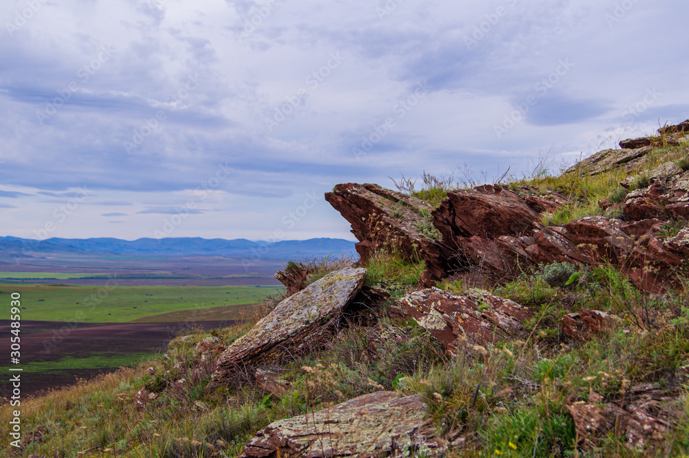 Sky. The clouds. Granite rocks. Fields. Sky. The clouds. Granite rocks. Fields.