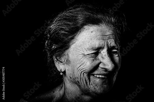 Portrait of an elderly woman with bright emotions on his face. Toned