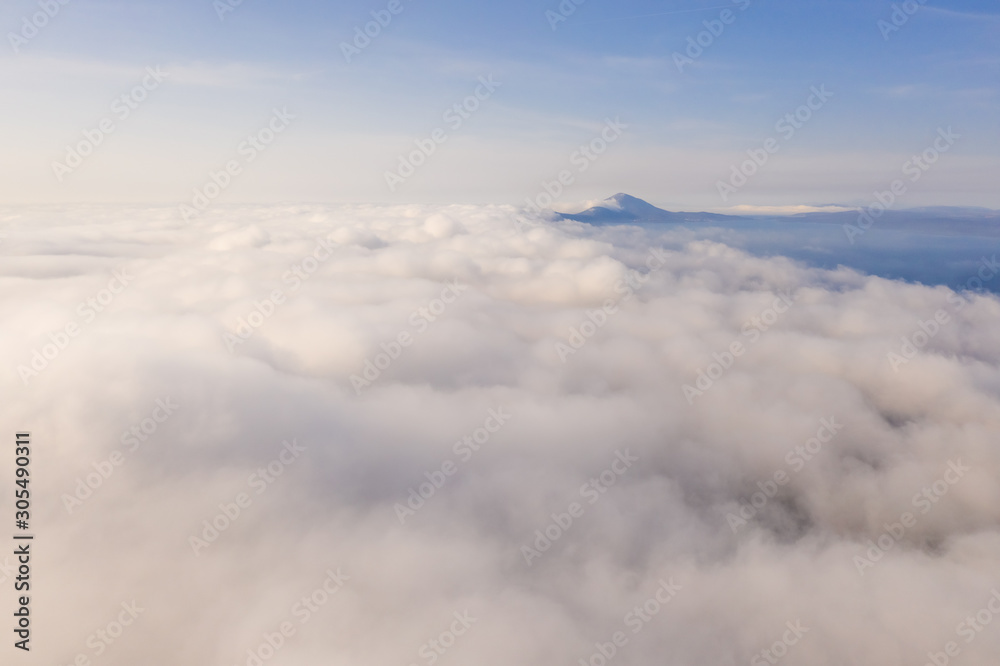 Aerial view above the clouds during the morning, Croatia. Aerial view above the clouds during the morning, Croatia.