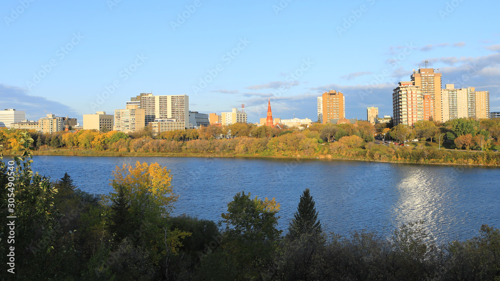 Scene of Saskatoon, Canada skyline over river