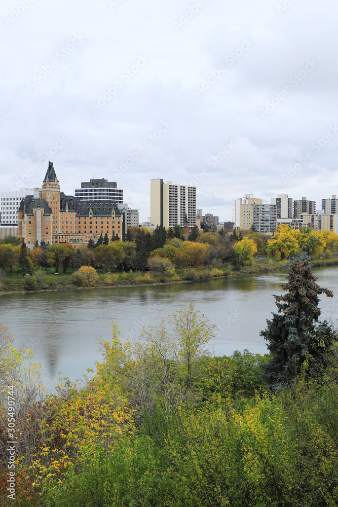 Vertical of Saskatoon, Canada cityscape by river