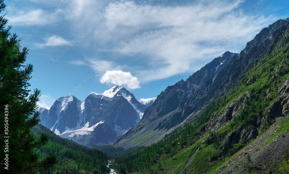 Landscape of snowy mountain peaks in the clouds. The concept of global warming and glacier melting. Landscape of snowy mountain peaks in the clouds. The concept of global warming and glacier melting.