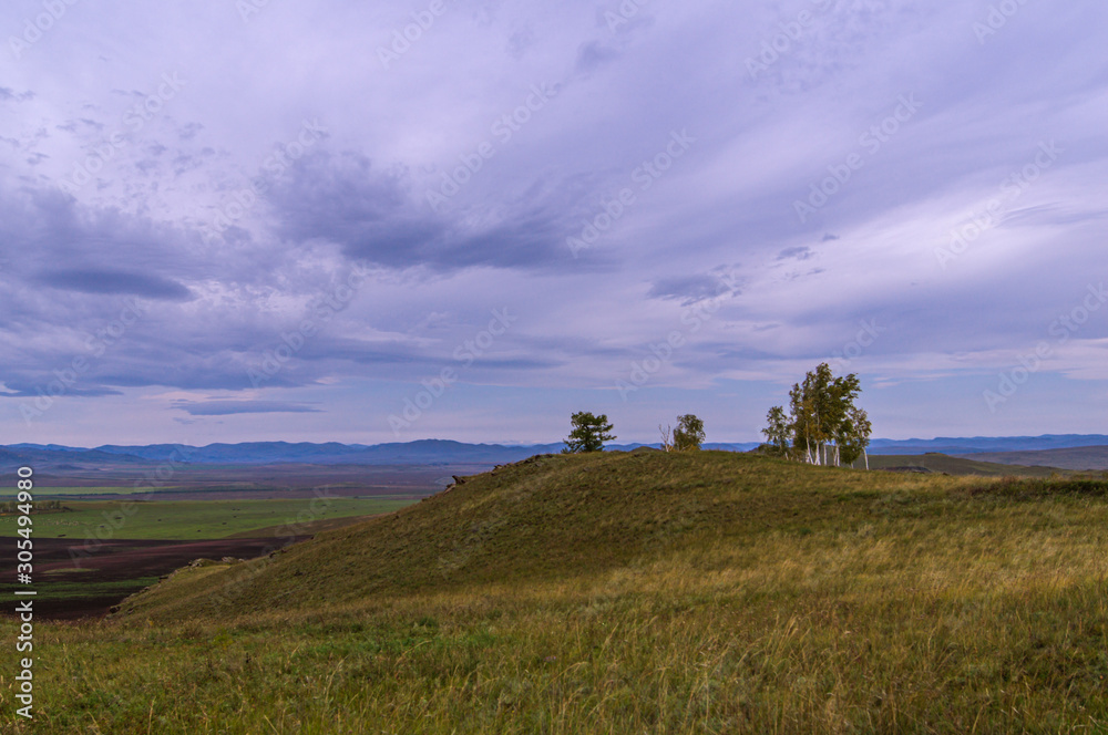 The trees. Hills. Sky. The clouds. Steppe