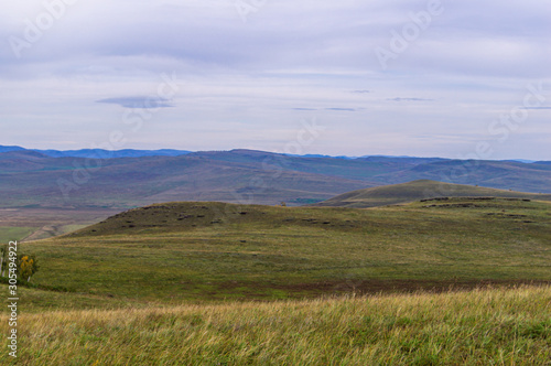 Hills. Sky. The clouds. The boundless steppe.
