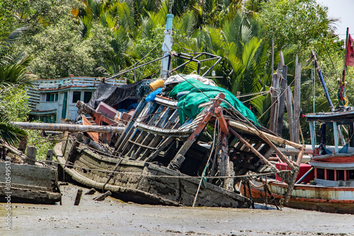 Wallpaper Mural The ship's ruin in the mud on the coast. The destroyed vessel lies in the bed of a dry river. Torontodigital.ca