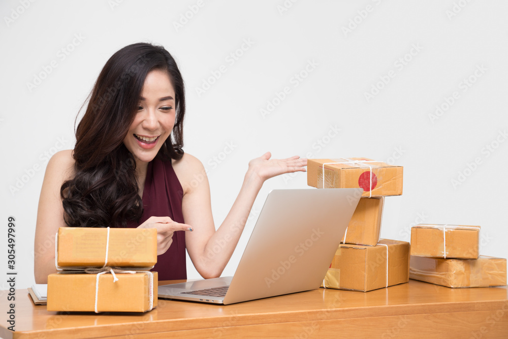 Young asian women with startup small business entrepreneur freelance working at home and excited about the orders of many customers, Online marketing packing box delivery concept, Thai model Young asian women with startup small business entrepreneur freelance working at home and excited about the orders of many customers, Online marketing packing box delivery concept, Thai model