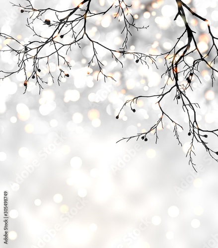 Black tree branches without leaves on bright silver glitter background. Garland lights decorated festive illustration. Shimmer pattern.