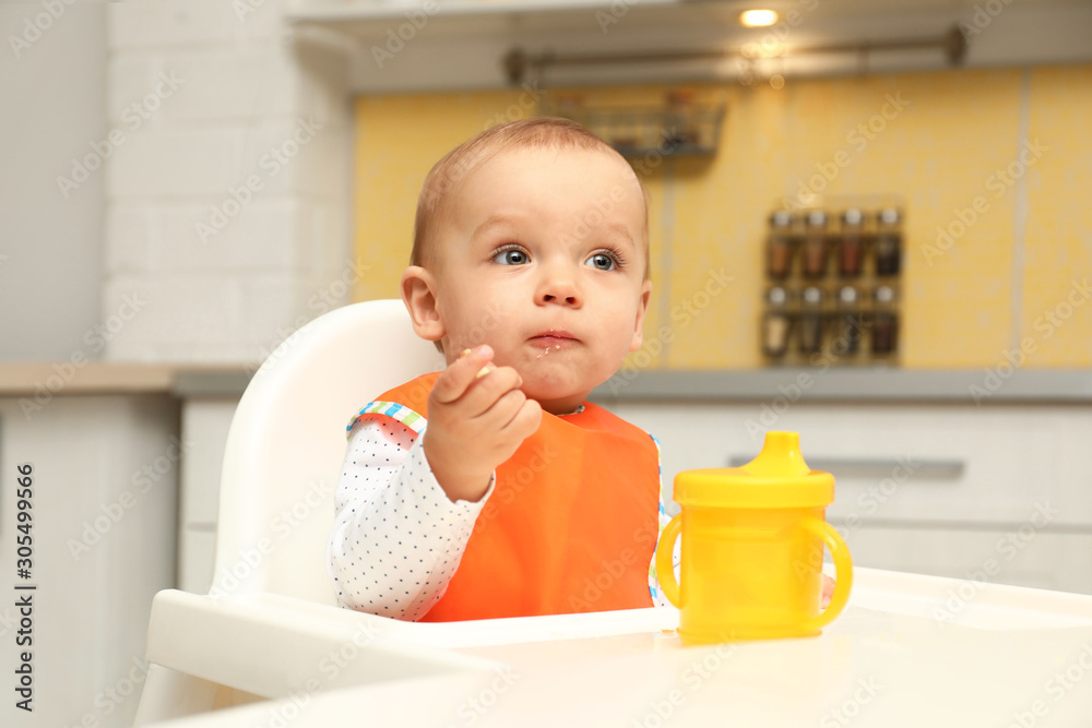 Cute little baby eating cookie at home Cute little baby eating cookie at home