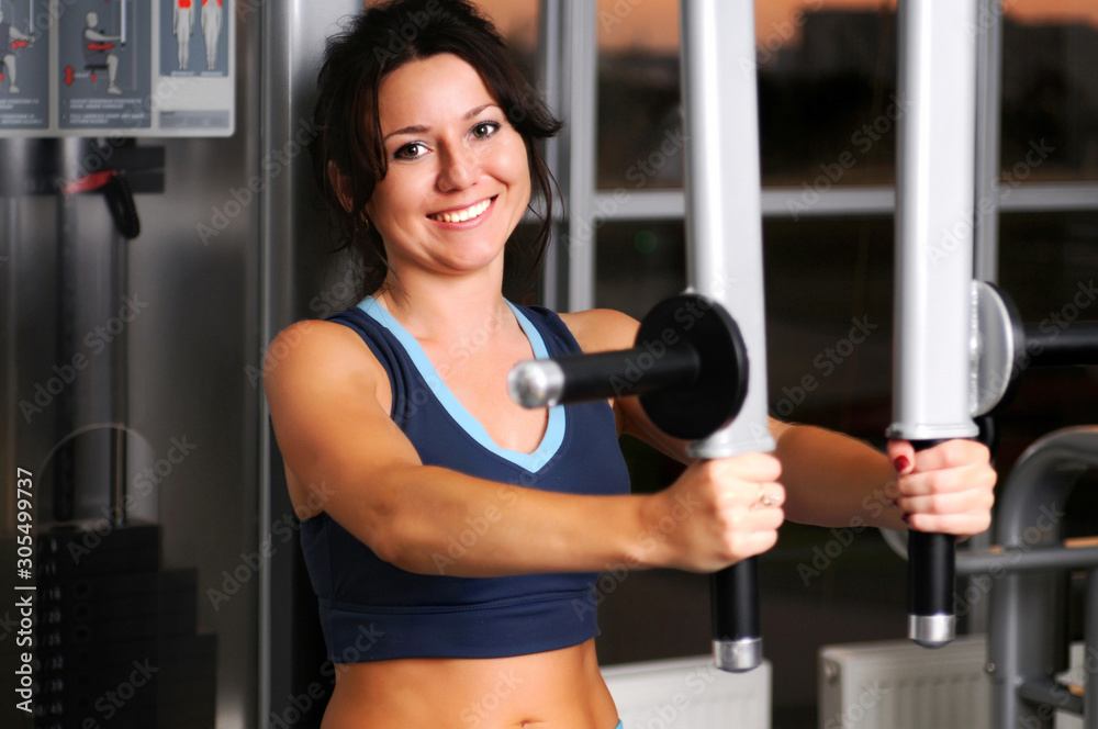 Fototapeta premium Woman doing exercise for arm muscles