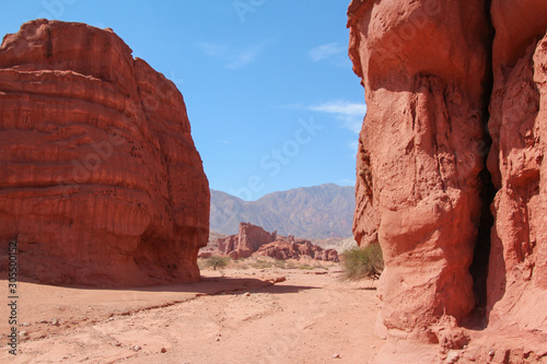 A road crosses the red rocks of La Quebrada de las Conchas  Argentina