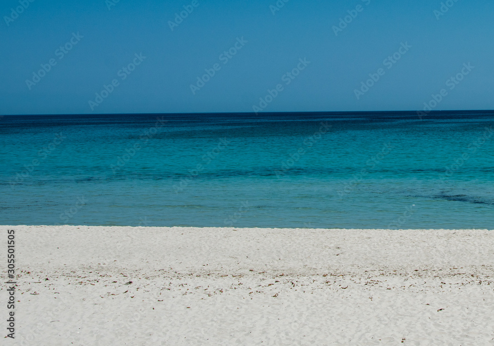 white sand beach blue sea and sky