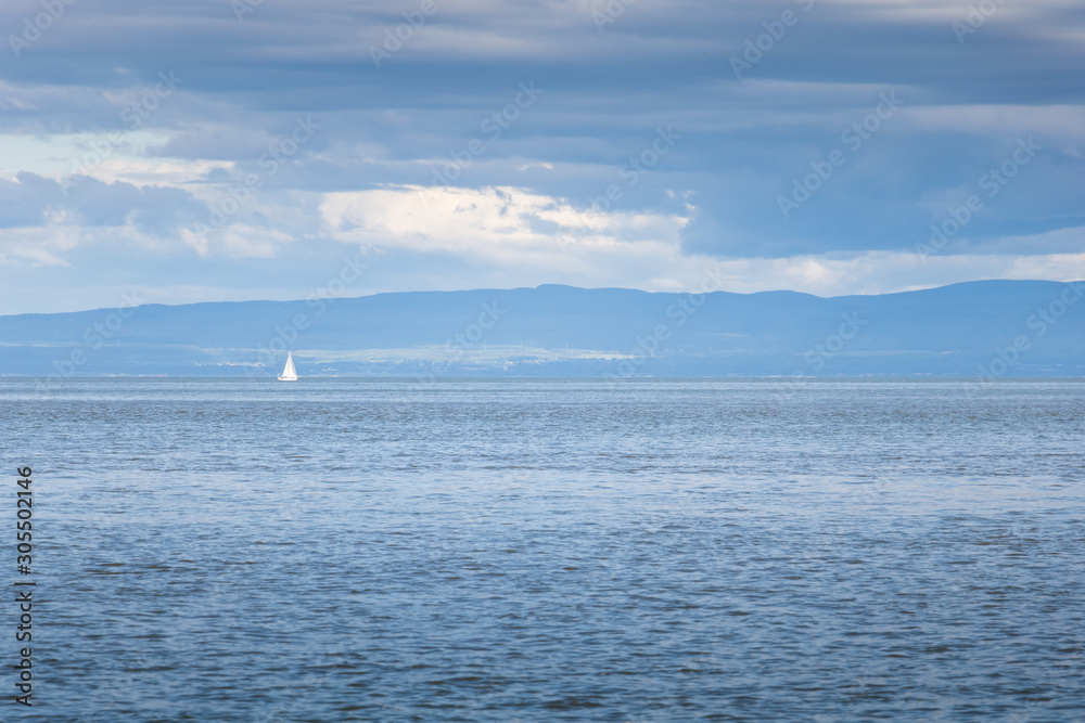 A sailing boat on the Saint-Lawrence river. 