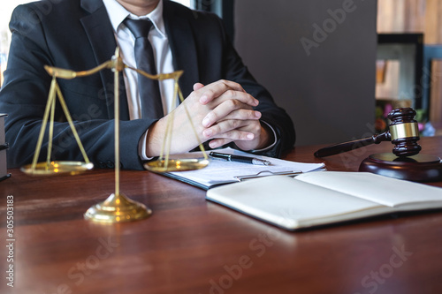 Professional male lawyer or counselor working with legal case document contract in office, law and justice, attorney, lawsuit concept © Thitiphat