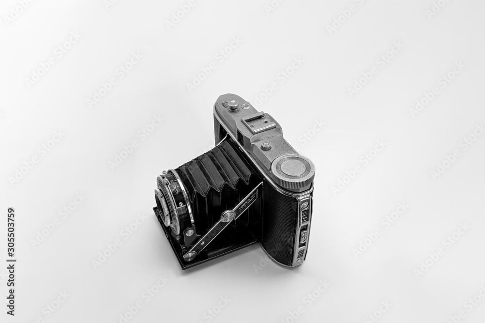 Nostalgic retro metal compact horizontal folding photo camera medium format with manual shutter Nostalgic retro metal compact horizontal folding photo camera medium format with manual shutter