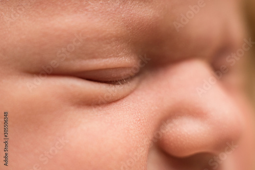 baby's face, eyes and nose. newborn baby, macro shot