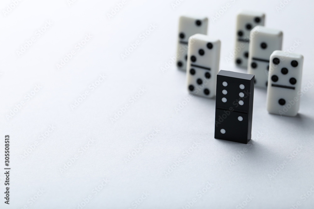 Leader concept. Domino tiles on grey background Leader concept. Domino tiles on grey background