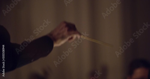 conductor's arm symphony orchestra