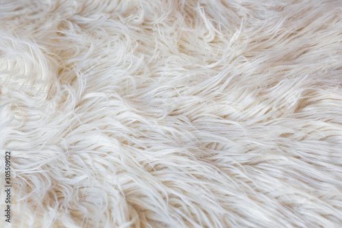 artificial fur background white cream. Flat lay.