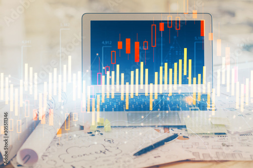 Stock market graph and table with computer background. Double exposure. Concept of financial analysis. © peshkova