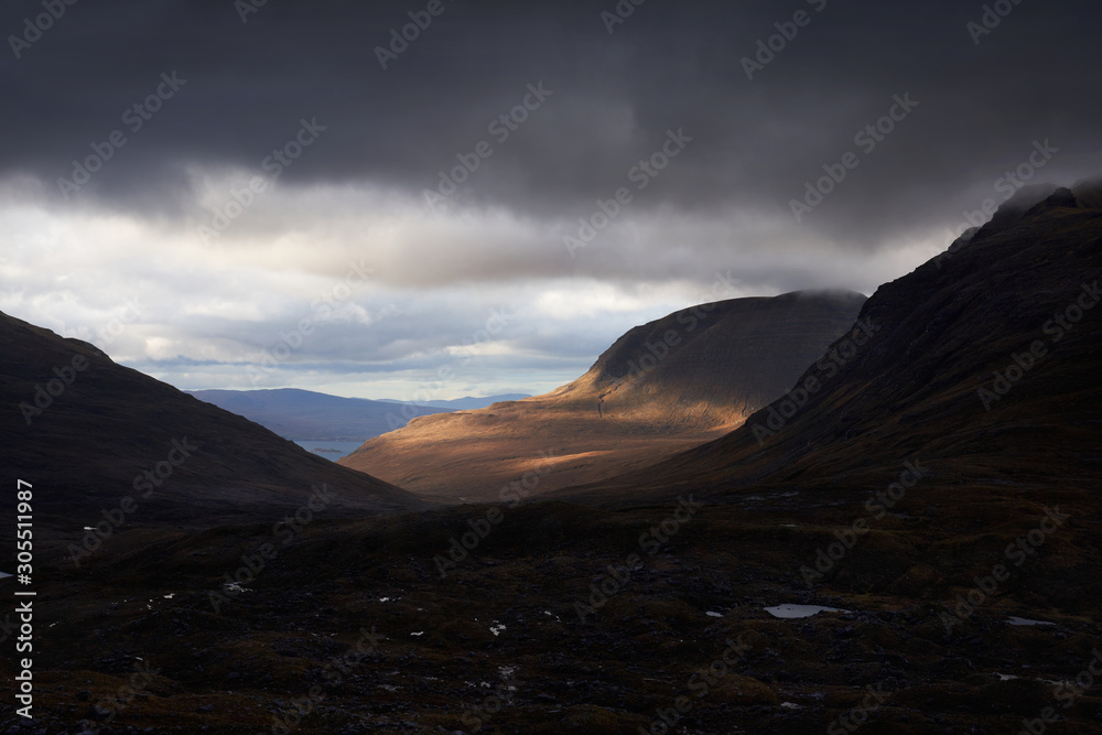 The summit of Tom na Gruagaich, Beinn Alligin, on a cloudy winters day near Torridon in the Scottish Highlands, UK.